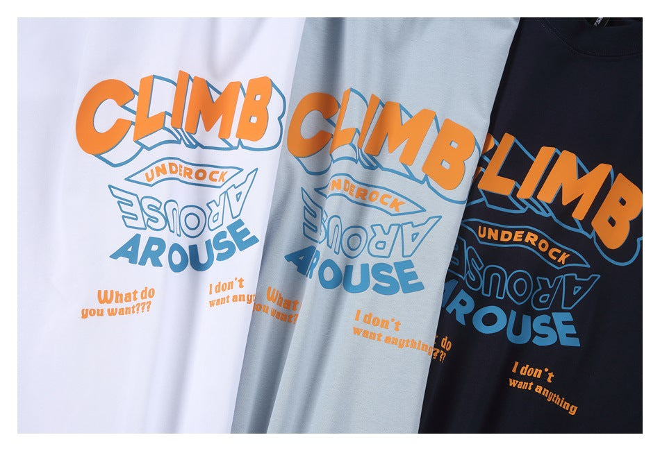 White, pale blue, and navy T-shirts arranged together, each with a large orange and blue graphic.