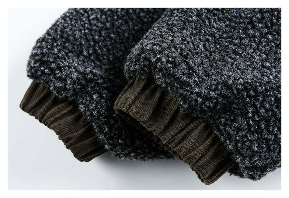 Close-up of dark charcoal textured cuffs with gathered brown fabric trim.