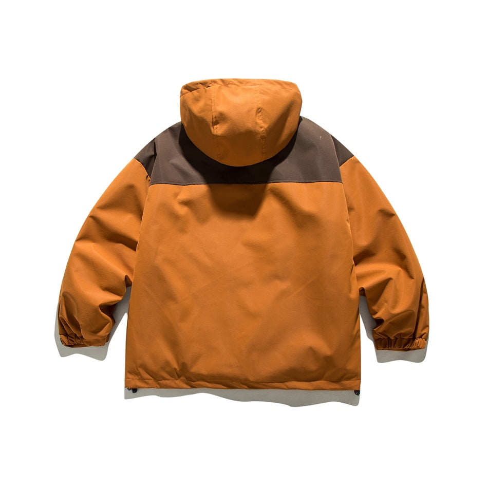 Back view of an orange hooded jacket with a dark brown shoulder yoke and elastic cuffs.