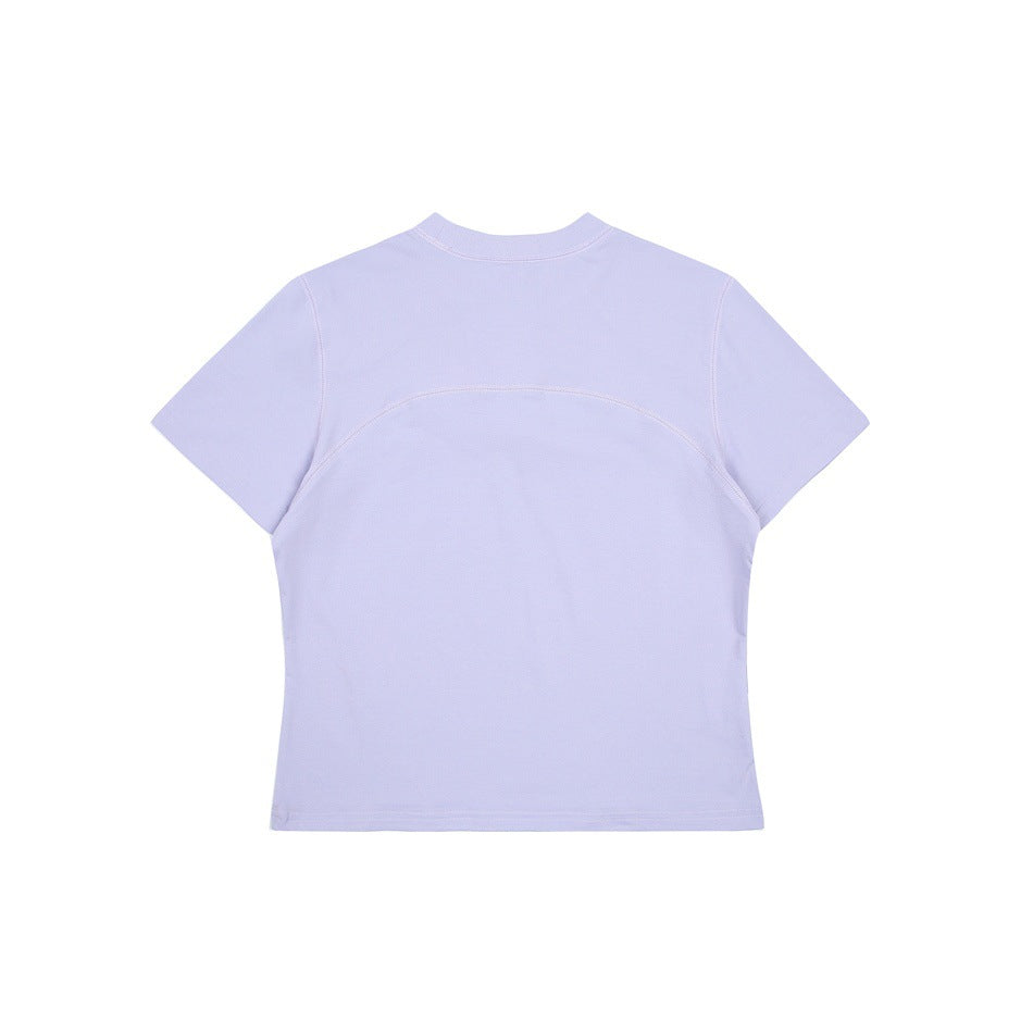 Back view of a light lavender short-sleeve crew-neck shirt with curved seam detailing across the upper back.