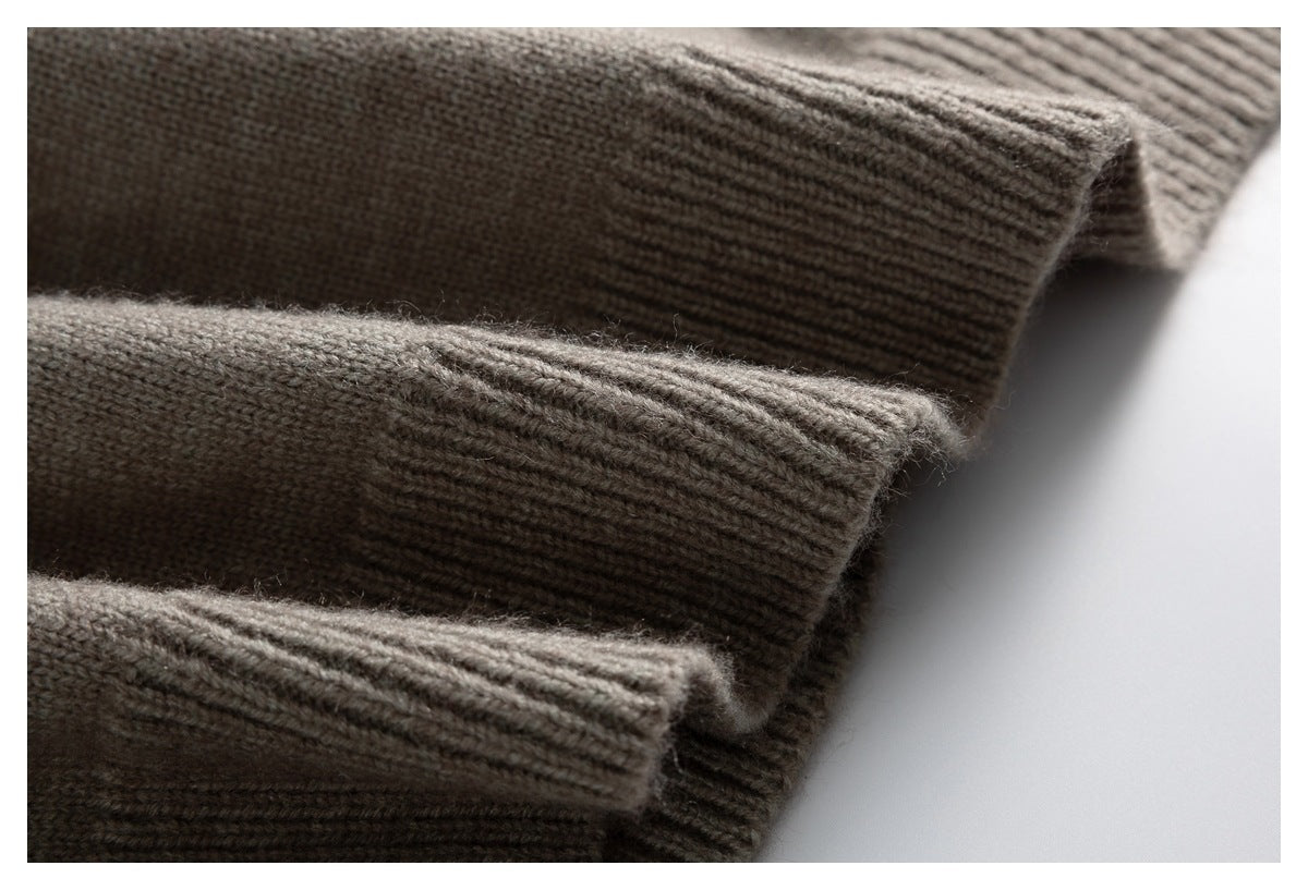 Close-up of layered ribbed edges on a taupe-gray knitted garment.