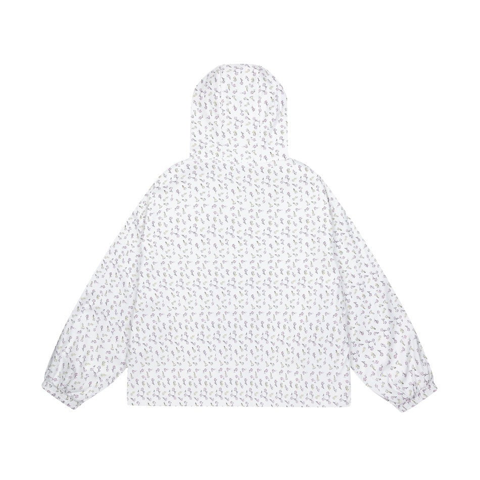 Back view of a white jacket with an all-over small floral print, hood, and gathered cuffs.