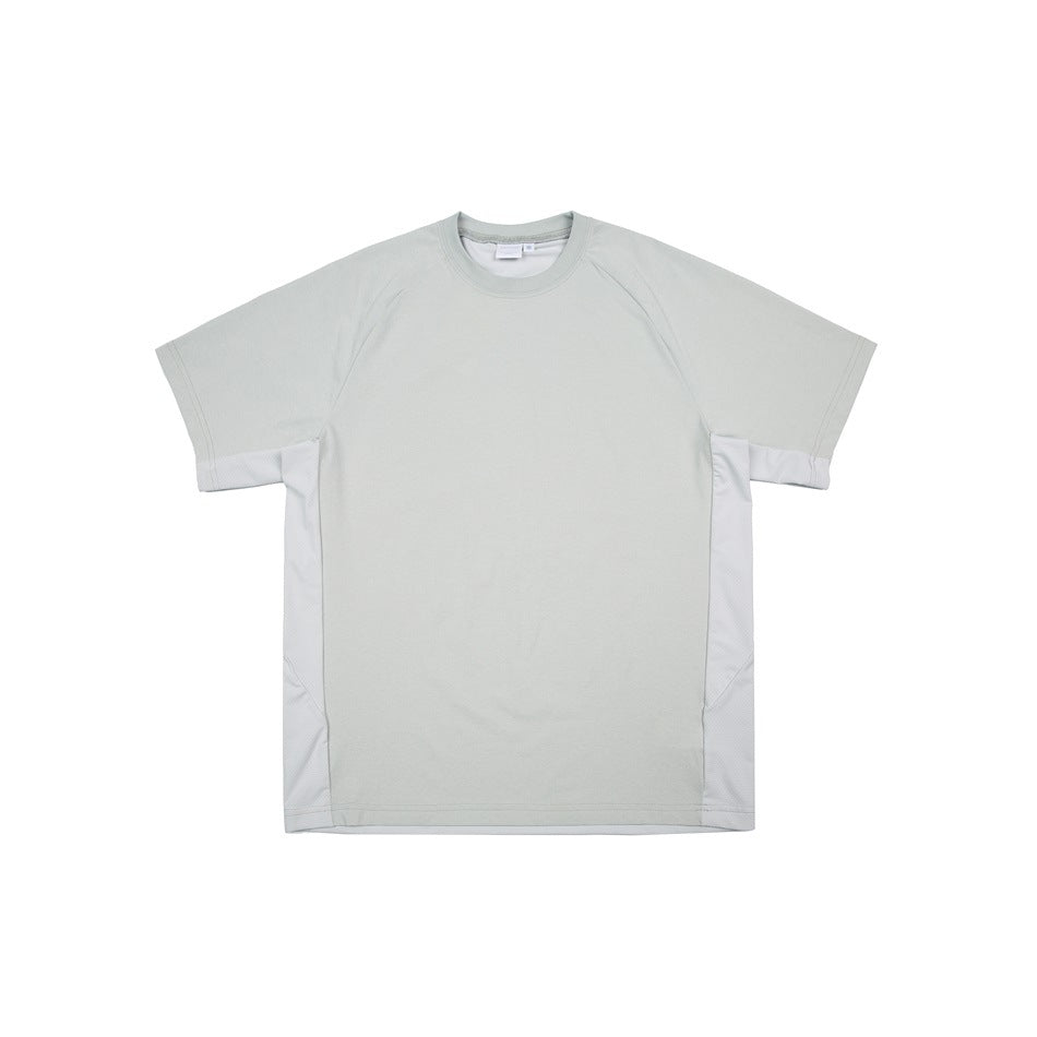Flat lay of a pale sage short-sleeve crewneck T-shirt with raglan seams and light textured side panels.