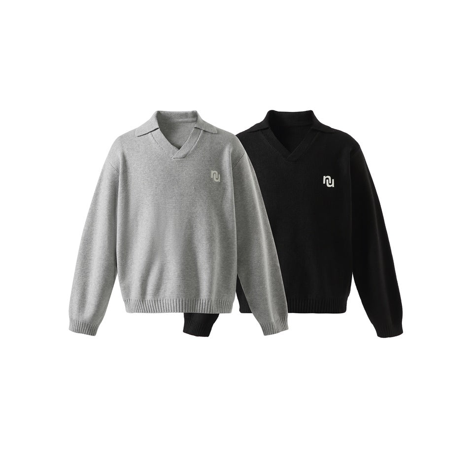 Front views of two ribbed sweaters with notched collars and small chest emblems, one light gray and one black.