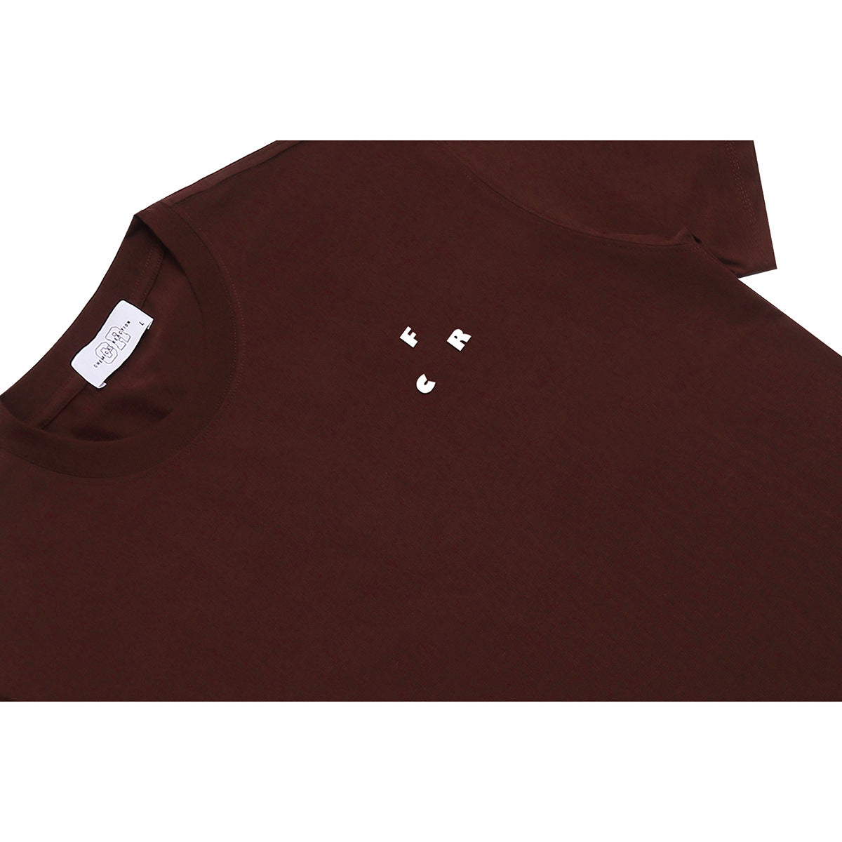 Close-up of a burgundy T-shirt neckline, label, and small white chest lettering.