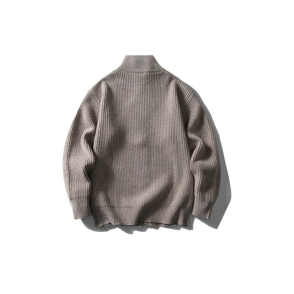 Back view of a taupe rib-knit cardigan with a high collar and long sleeves.