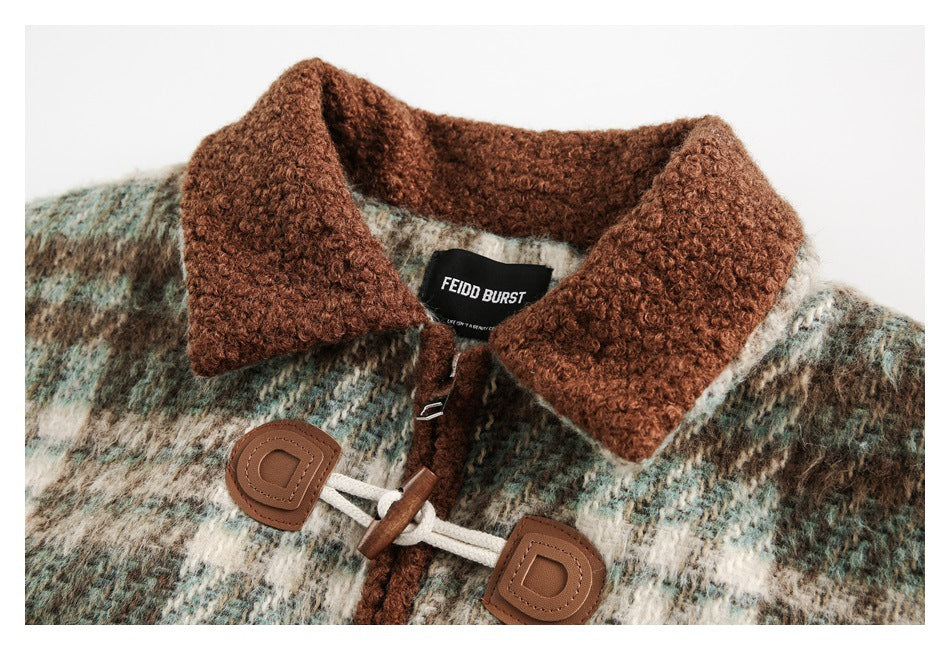 Close-up of the jacket’s textured brown collar, plaid fabric and cream cord toggle closures.