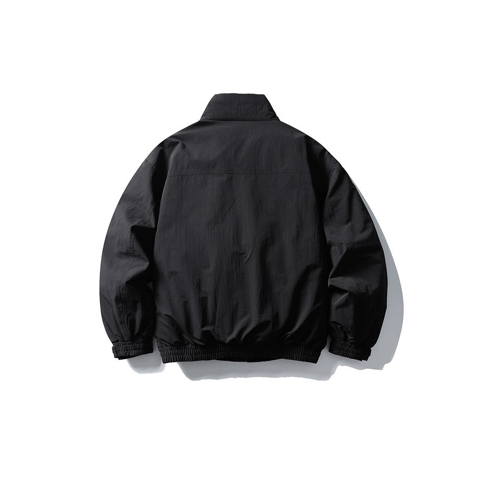 Black stand-collar jacket flat lay, back view, with back yoke seam, elastic hem and cuffs