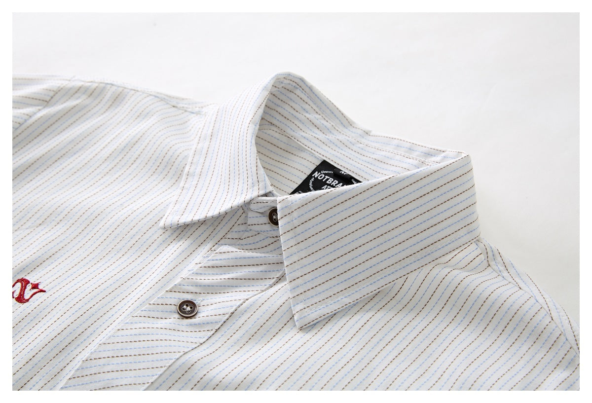 Close-up of a white striped shirt collar, placket and buttons against a light background.