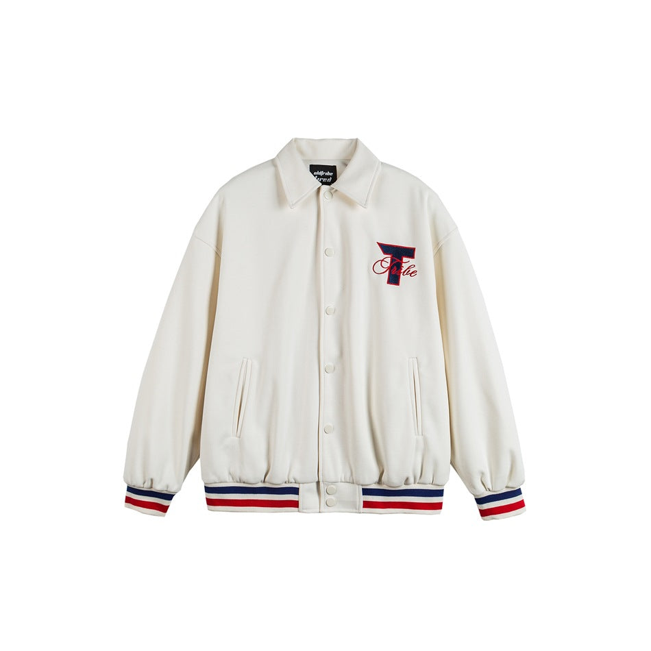 Off-white varsity-style jacket, front view, with snap buttons, navy and red striped ribbed trim and embroidered T logo