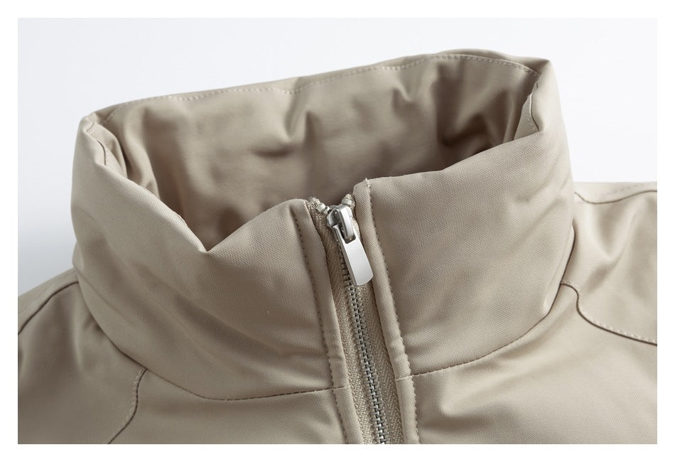 Beige jacket stand collar and front zipper shown in a close-up.