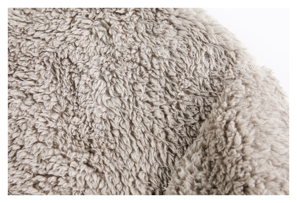 Close-up showing the sweatshirt's dense, shaggy beige-gray plush surface.