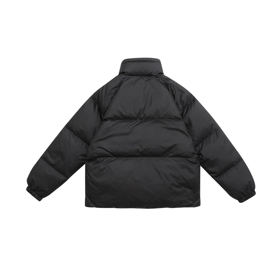 Back view of a black quilted puffer jacket with a stand collar, horizontal baffles and elastic cuffs.
