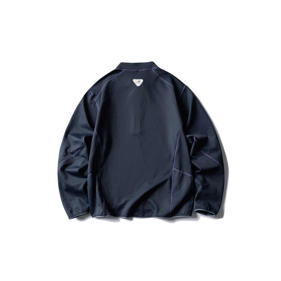 Back view of a dark navy pullover with purple contrast seams and a small upper-back patch.
