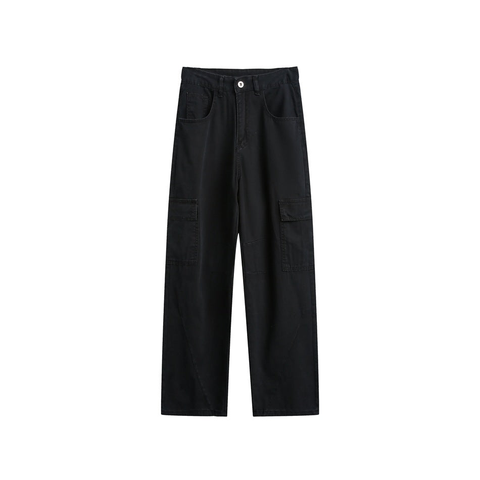 Front view of black wide-leg cargo pants with curved front pockets and flap thigh pockets.