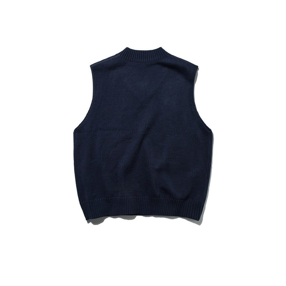 Back view of a dark navy sleeveless knit sweater vest with a ribbed neckline and hem.