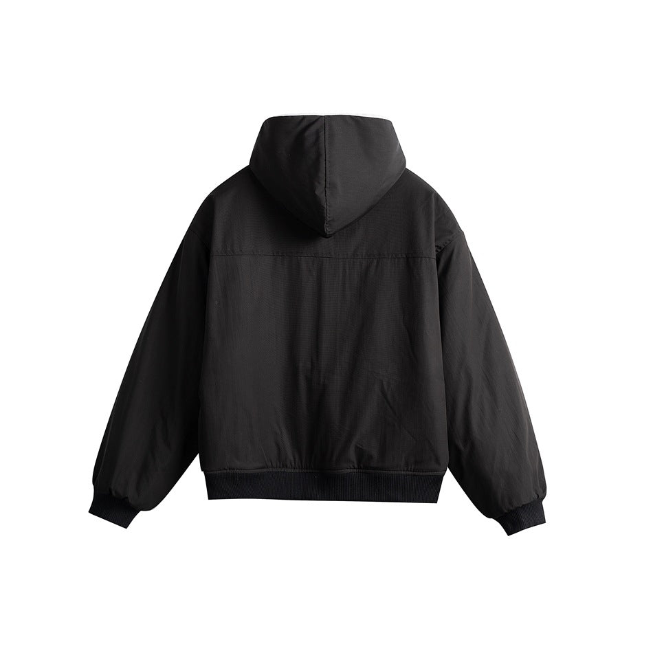 Back view of black hooded jacket with yoke seam, ribbed cuffs and hem
