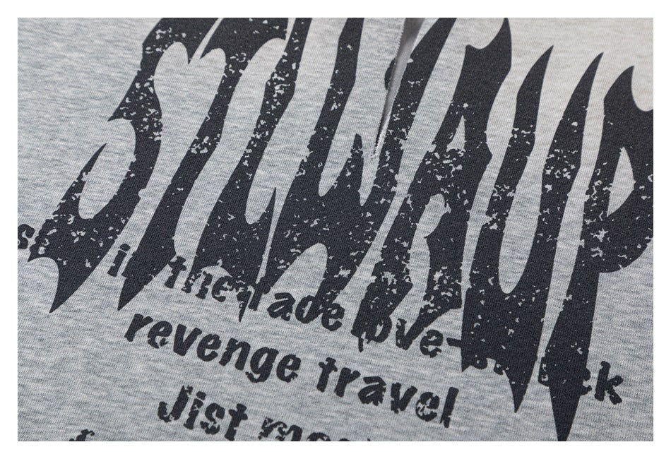 Close-up of distressed black lettering and smaller English text printed on a heather-gray garment.