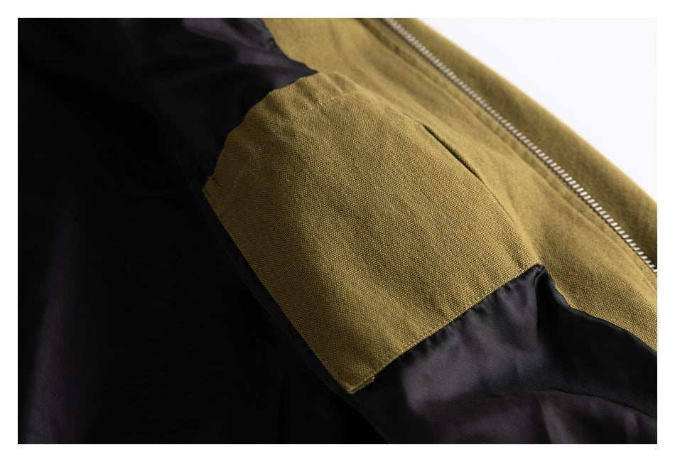 Close-up of the jacket's black lining, olive-brown interior pocket, and metal zipper.