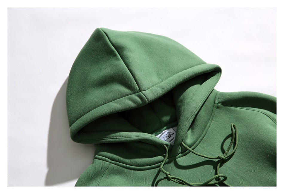 Close-up of the green hoodie’s hood, neckline, and matching drawstrings.