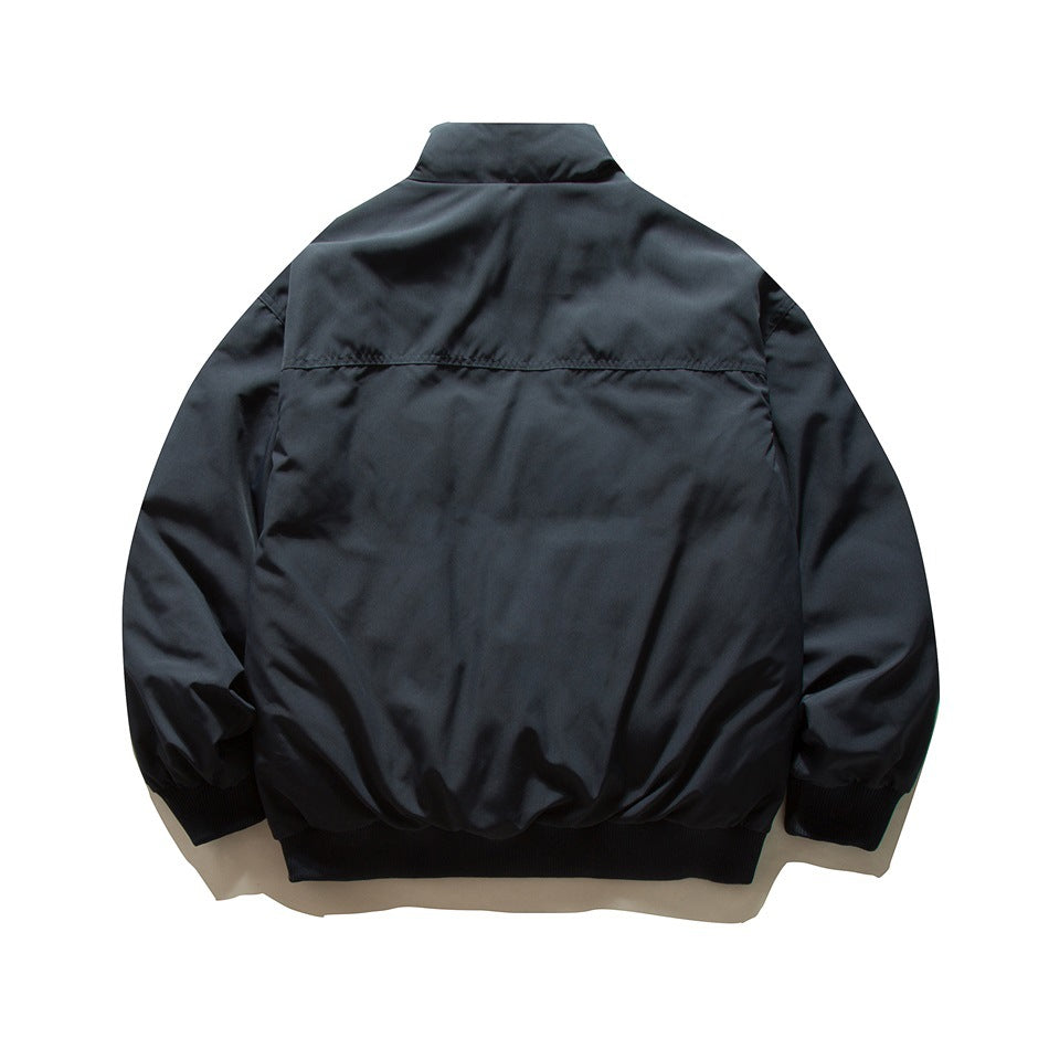 Navy blue stand-collar jacket back view with yoke seam and ribbed cuffs and hem, flat lay
