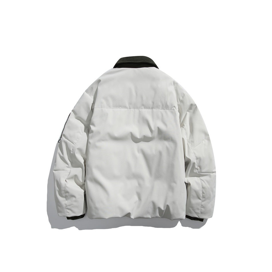 Back view of an off-white jacket with a dark collar and a horizontal seam across the upper back.