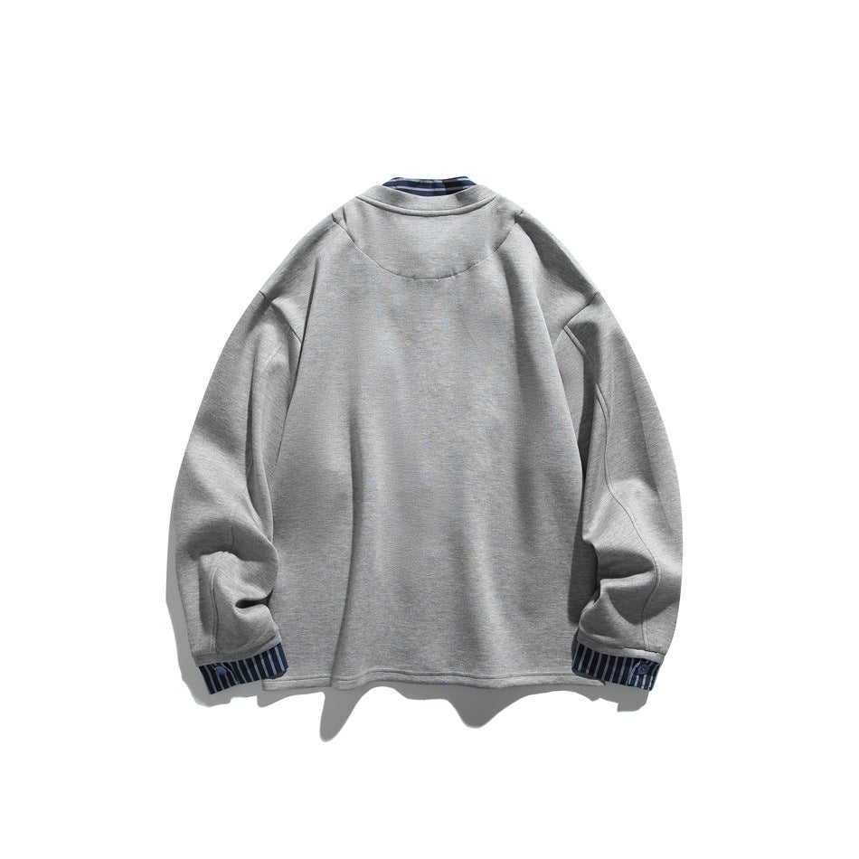 Back view of a gray long-sleeve button-front jacket with dark blue striped collar and cuffs, shown flat on white.