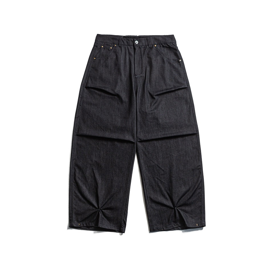 Black wide-leg pants with pinched hem pleats, front flat lay view