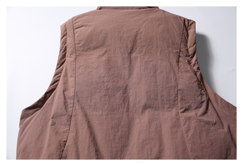 Rear view of a brown jacket showing the back panel and side seams.