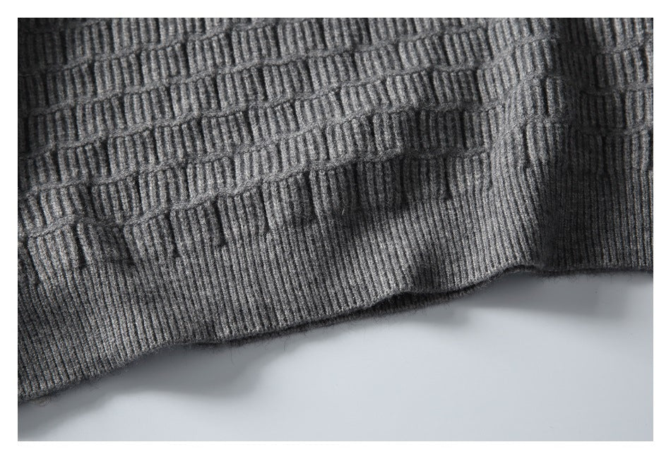 Close-up of the sweater’s textured knit and ribbed hem.