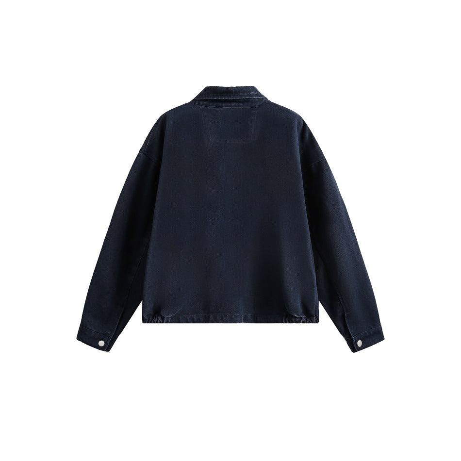 Back view of a dark navy jacket with a pointed collar, dropped shoulders, long sleeves, and snap cuffs.