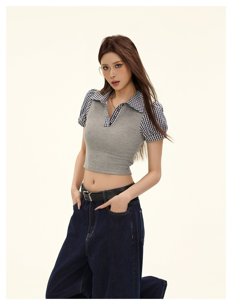 Model wearing a gray cropped polo top with navy-and-white gingham collar and puff sleeves, shown from the front.