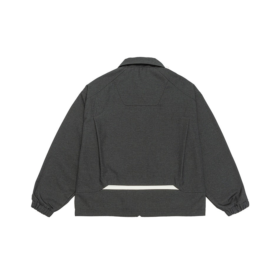Back view of a charcoal gray cropped jacket with a collar, panel seams, and gathered cuffs.