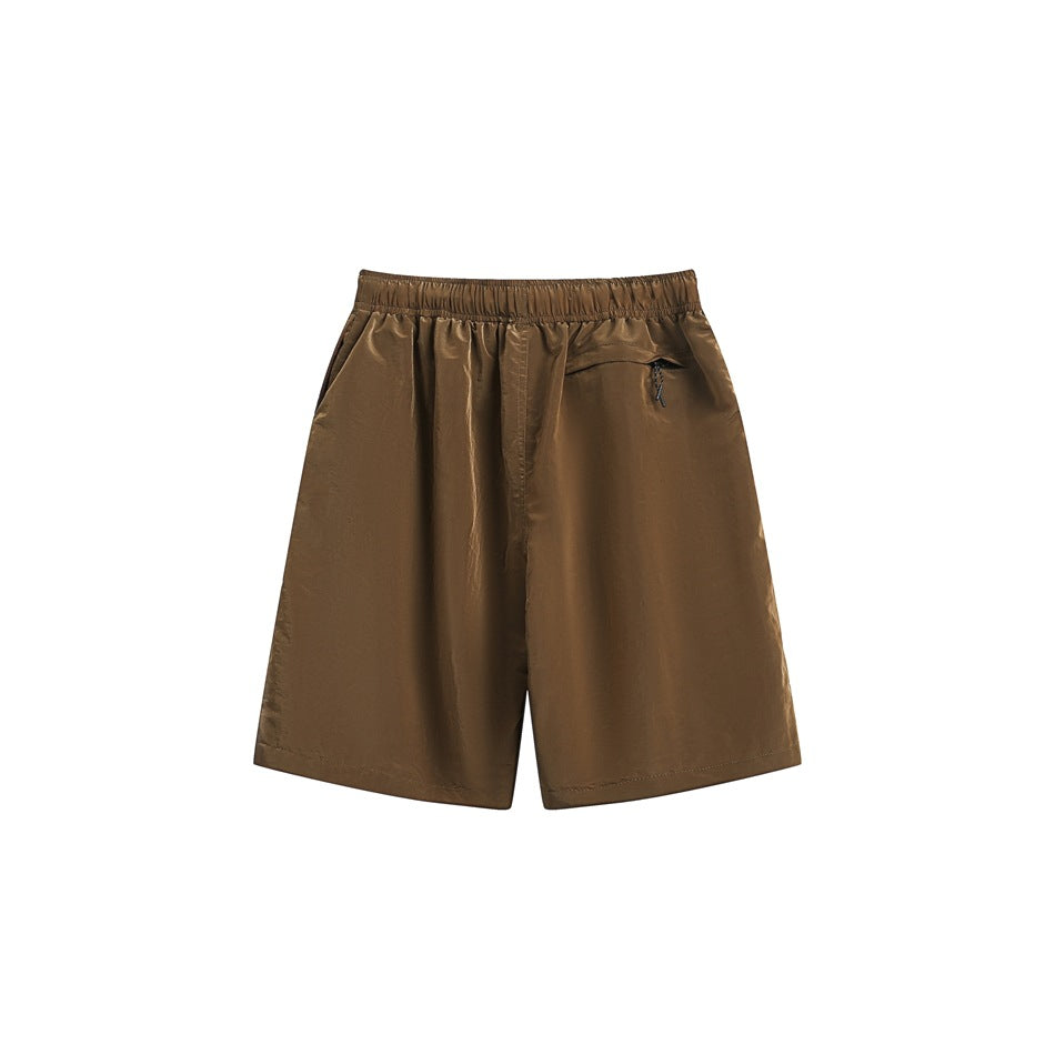 Brown shorts shown from the back, with an elastic waistband and a small zip pocket.