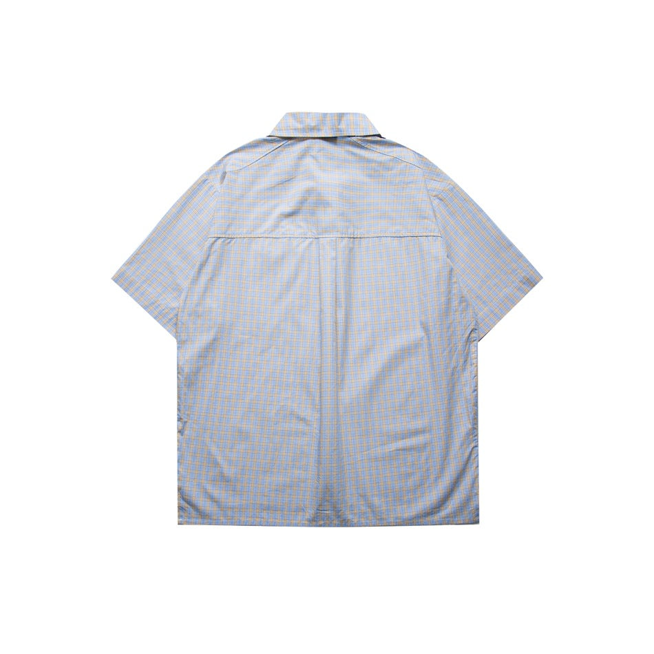 Back view of light blue small-check short-sleeve shirt laid flat, showing shoulder yoke seam