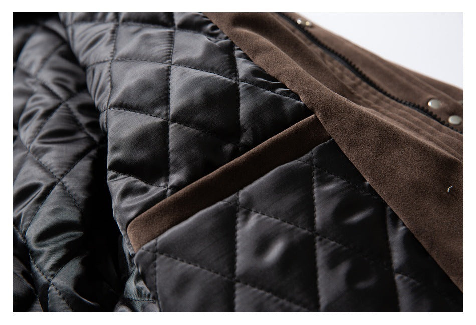 Close-up of a brown coat opened to show its black diamond-quilted lining.