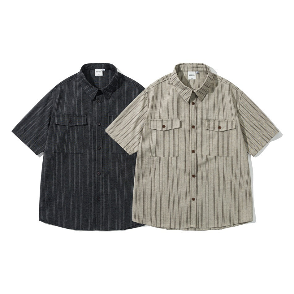 Two short-sleeved button-up shirts with chest pockets, in charcoal and beige striped colorways.