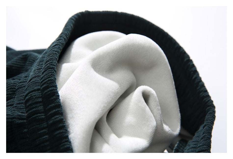 Close-up of the soft white interior lining framed by dark teal ribbed fabric.