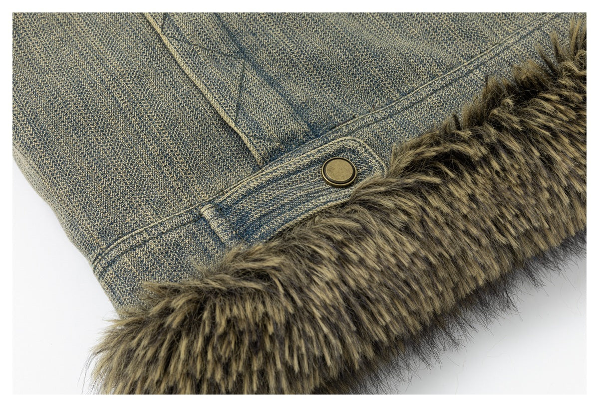 Close-up of the blue-gray jacket hem with brown faux-fur trim and a brass-tone snap tab.