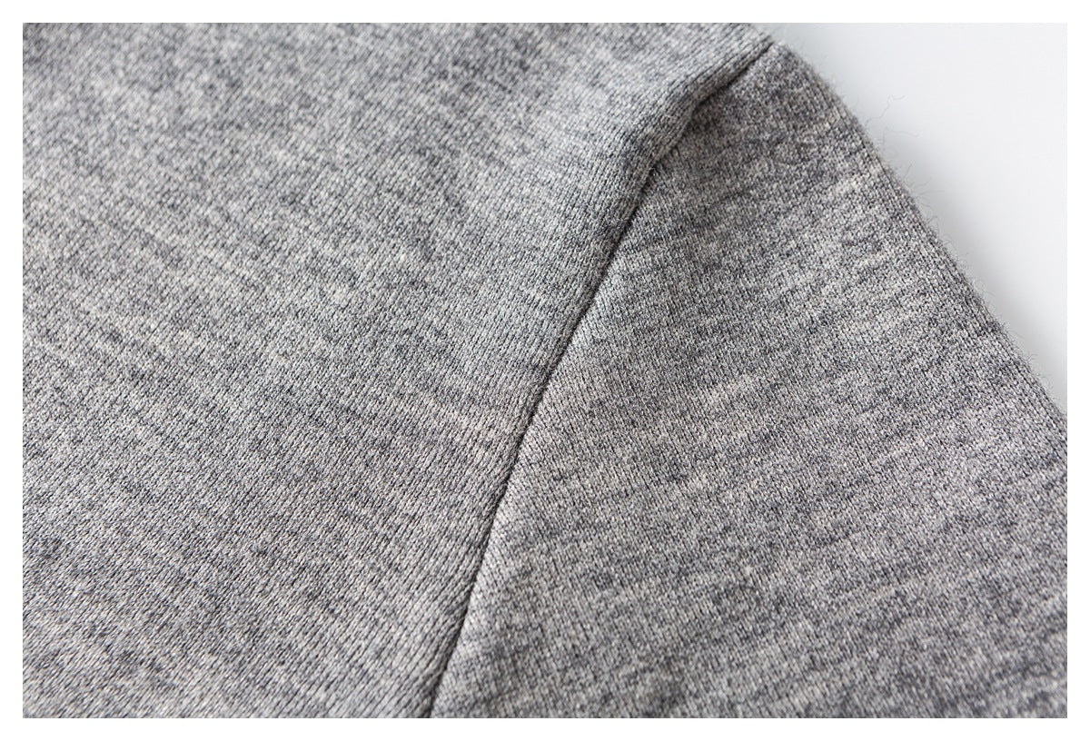 Close-up of the heather gray knit fabric and curved shoulder seam.