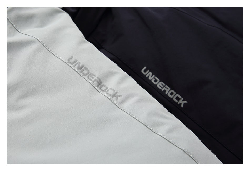 Close-up of gray and black garments with the word “UNDEROCK” printed on the fabric.