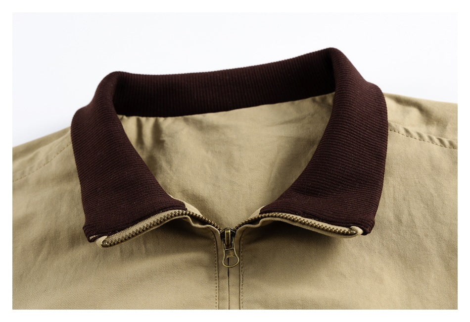 Close-up of the khaki jacket's dark brown collar, opened over the front zipper.