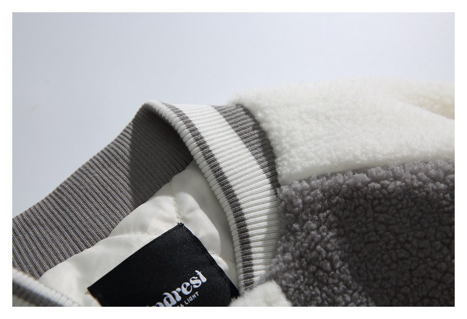 Close-up of the jacket collar, striped ribbed trim, lining, and a sewn black label.