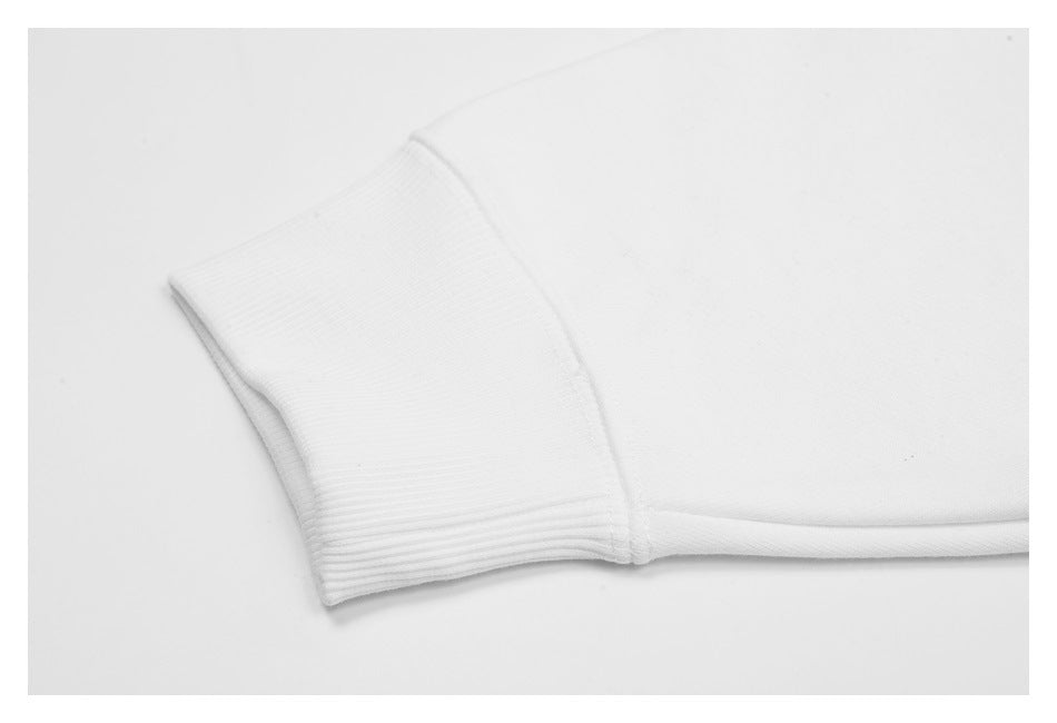 Close-up of a white sleeve ending in a wide ribbed cuff.