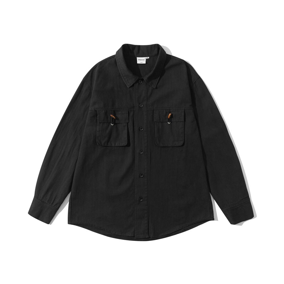 Black long-sleeve button-up shirt with two flap chest pockets and wooden bead toggles, flat lay front view
