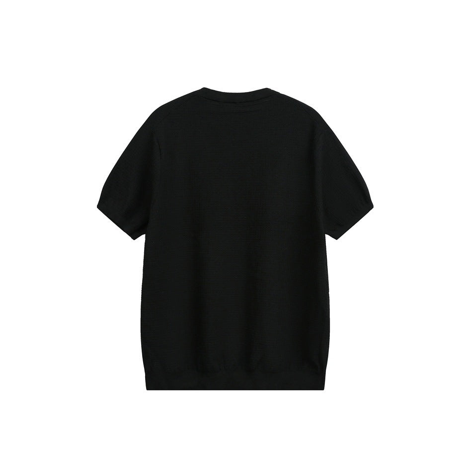 Back view of a plain black short-sleeve knit shirt with a ribbed crew neck and hem.
