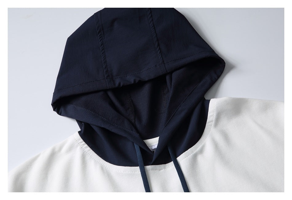 Close-up of the navy hood, drawstrings, and neckline on a white short-sleeve hoodie.