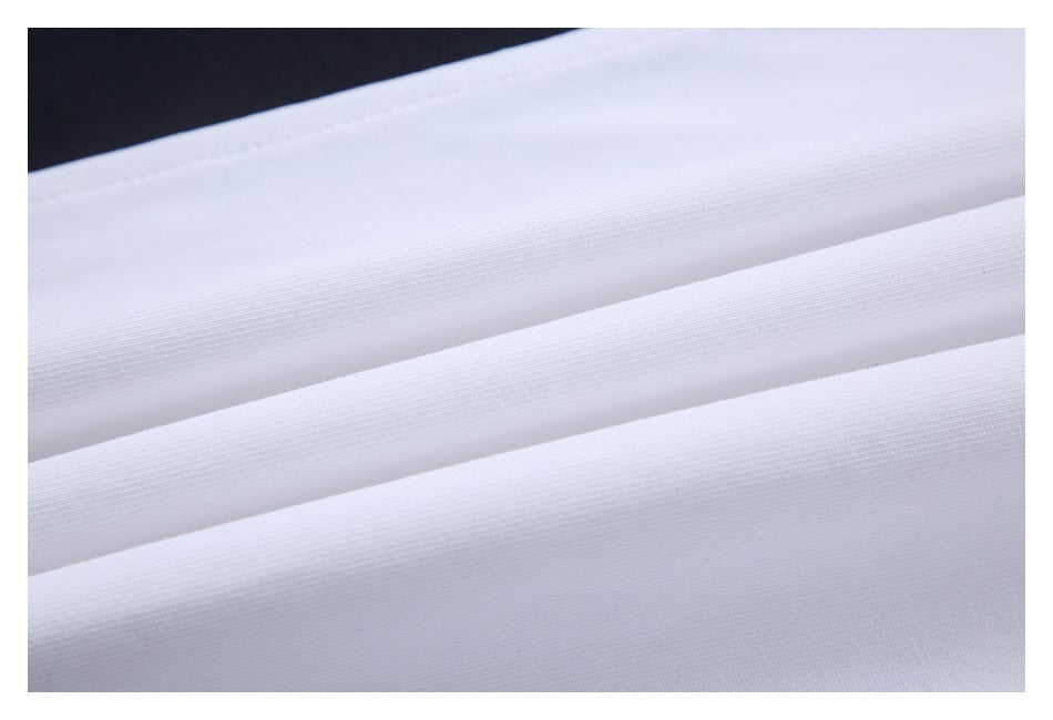 Close-up of folded white fabric showing its fine, even surface texture.