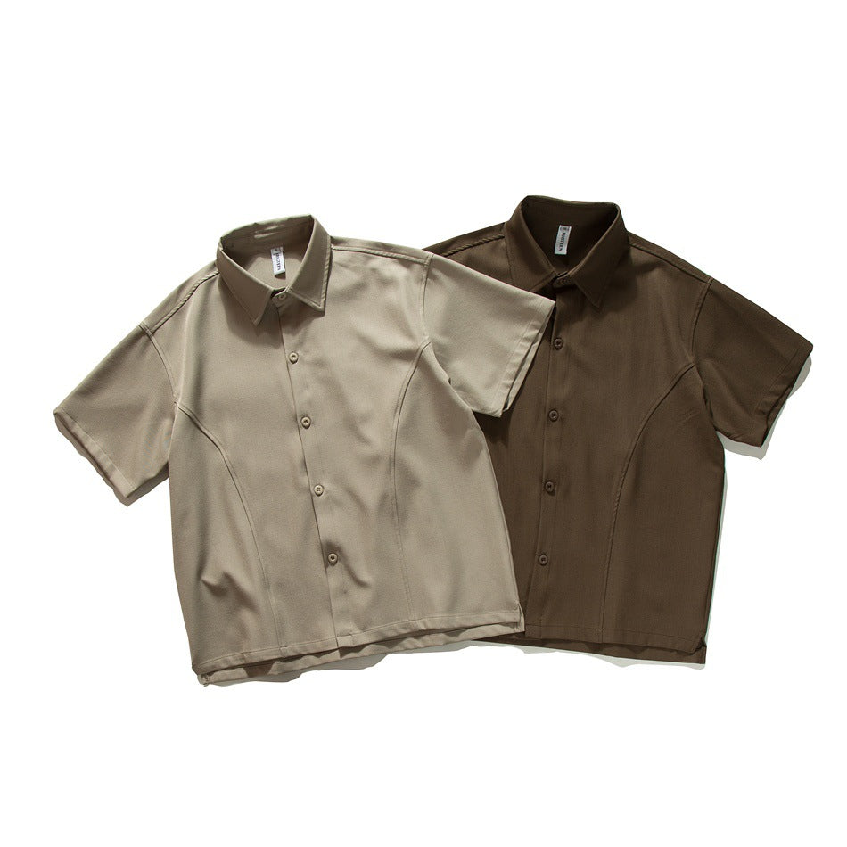 Two short-sleeve button-up shirts laid flat: one light taupe and one dark brown.