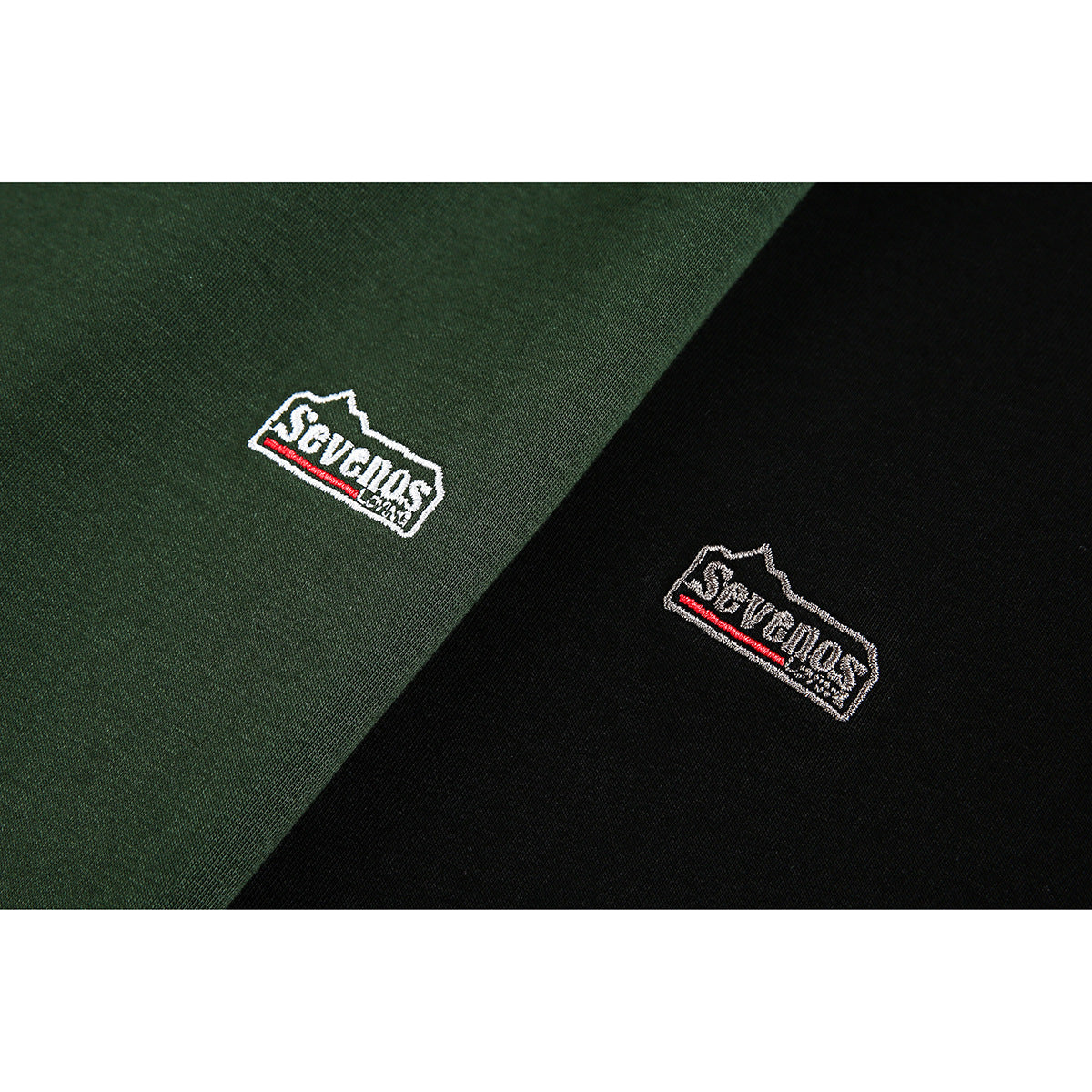 Close-up of small embroidered chest logos on dark green and black polo shirts.